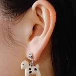 ear-piercing-jewelry-enamel-pony-ear-studs-1 Material: enamel, sliver stud Color: white Quantity: 1 pair/ set