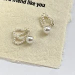 ear-piercing-jewelry-pearl-chain-leaf-ear-studs-2 ear jewellery
