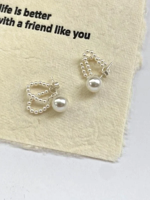 ear-piercing-jewelry-pearl-chain-leaf-ear-studs-2 ear jewellery