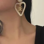 ear-piercing-jewelry-pearl-heart-ear-studs-4 pearl earrings