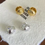 ear-piercing-jewelry-round-daisy-ear-studs-5 gold earrings