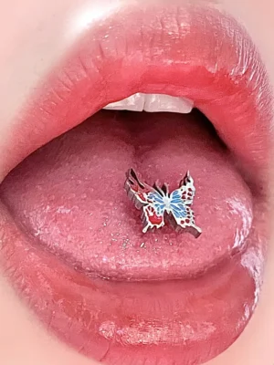 body-jeweller-butterfly-tongue-stud-1 Bubbleoo butterfly tongue stud with blue gem worn in mouth