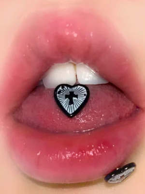 body-jewellery-heart-cross-tongue-stud-2 Heart shaped cross tongue stud model shot - Bubbleoo