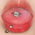 body-jewellery-planet-tongue-stud-1 Sparkling planet tongue stud piercing close-up - Bubbleoo