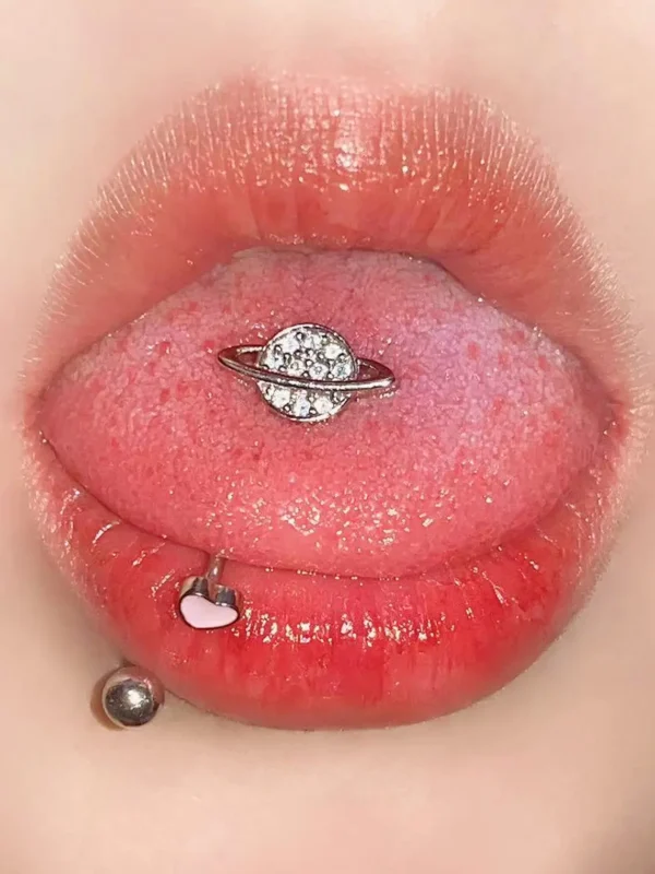 body-jewellery-planet-tongue-stud-1 Sparkling planet tongue stud piercing close-up - Bubbleoo