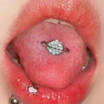 body-jewellery-planet-tongue-stud-2 Sparkling planet tongue stud piercing close-up - Bubbleoo