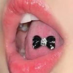 body-jewellery-shiny-bone-tongue-stud-2 Bubbleoo black bow tongue stud with gems worn in mouth